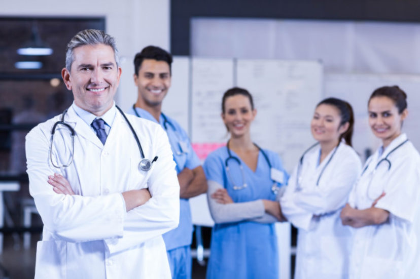 portrait-medical-team-standing-with-arms-crossed-hospital_107420-8752_uniform